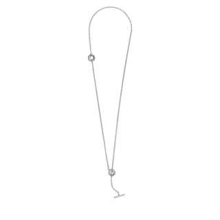 Ogrlica v obliki obroča z dodatkom pavé, ter paličico v obliki črke T. 