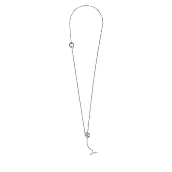 Ogrlica v obliki obroča z dodatkom pavé, ter paličico v obliki črke T. 